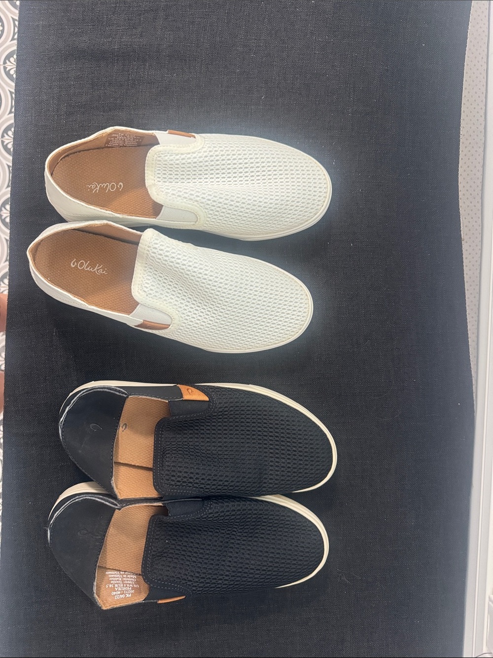 OluKai woman’s  Slip-On Mesh Loafers in White and Black with Tan Accents